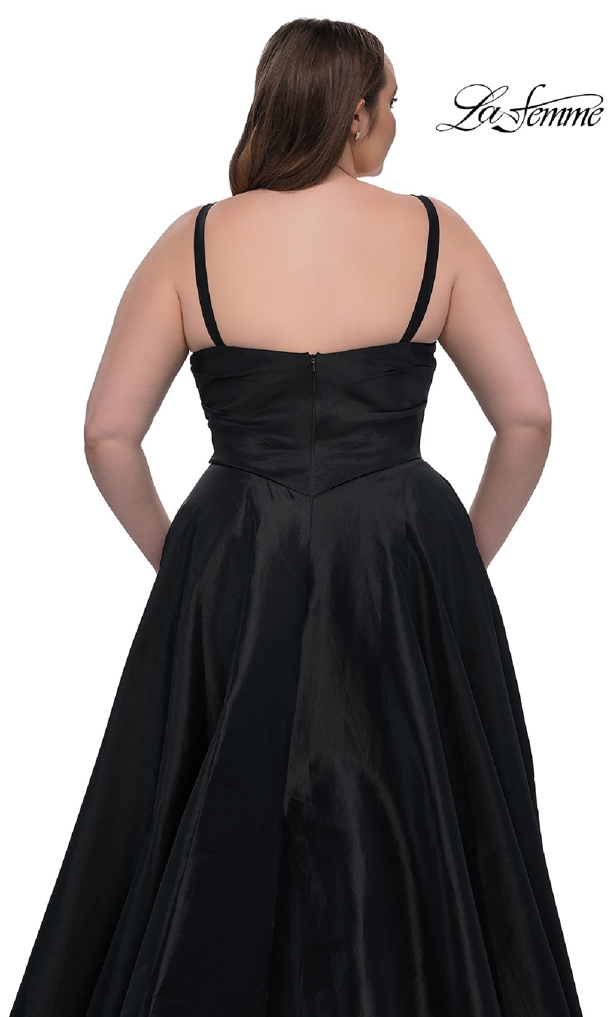 A woman is seen from the back wearing the La Femme 33075, a black, sleeveless, floor-length plus-size prom dress with thin straps and a fitted bodice. The background is white with the